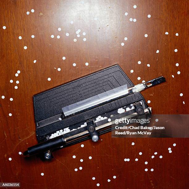 messy hole puncher - hole punch stock pictures, royalty-free photos & images