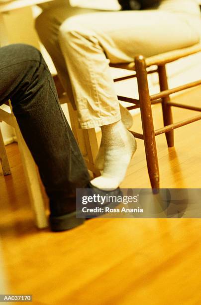 playing footsie - playing footsie stock pictures, royalty-free photos & images