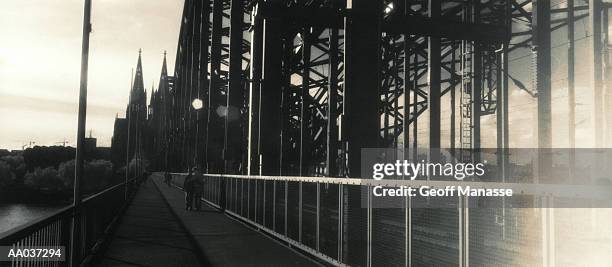 bridge leading to cologne, germany - cologne germany stock pictures, royalty-free photos & images