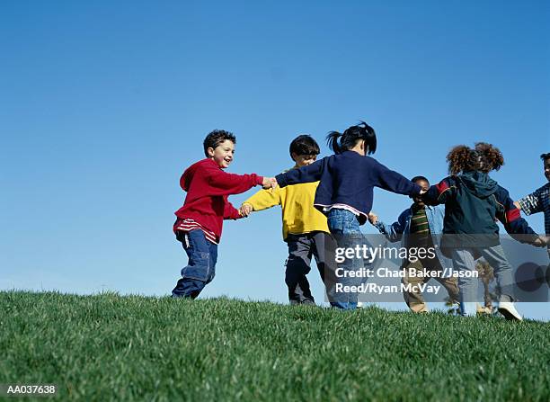 children playing ring-around-the-rosy - ring around the rosy stock pictures, royalty-free photos & images