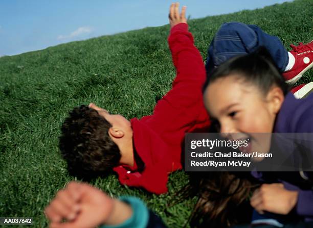 children play ring-around-the-rosy and fall down - ring around the rosy stock pictures, royalty-free photos & images