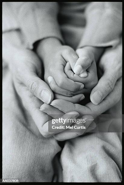 mother and son praying together - godsdienstvrijheid stockfoto's en -beelden