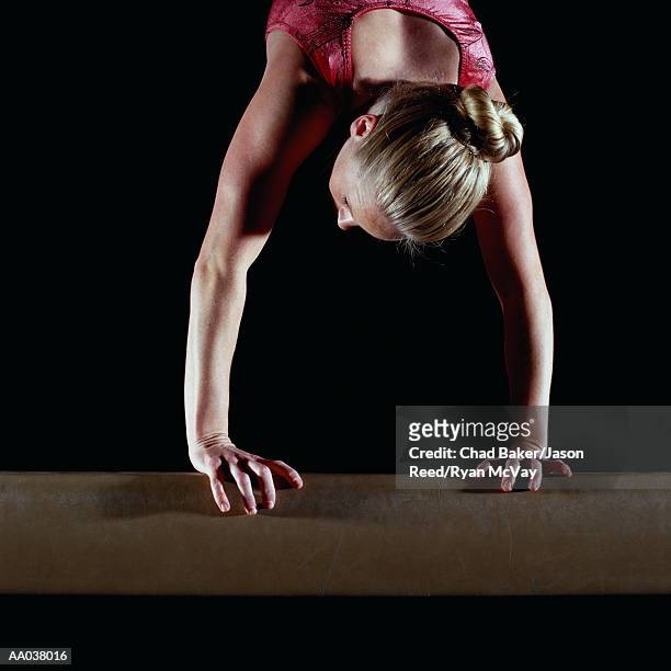 female gymnast balanced on vault - vaulting gymnastics stock pictures, royalty-free photos & images