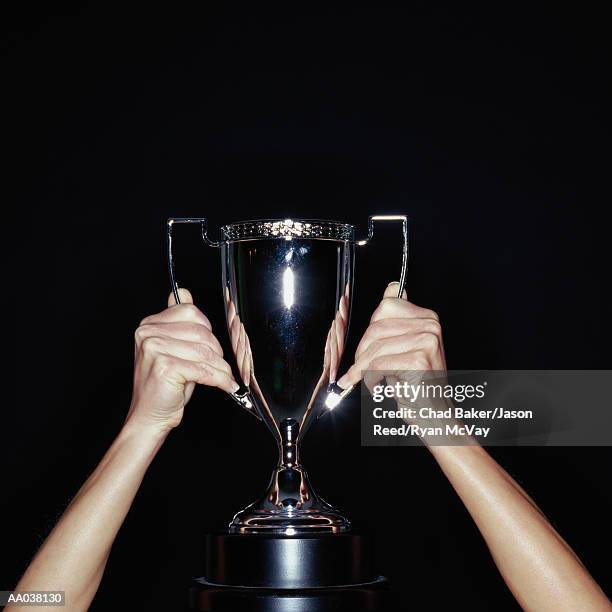 Hands Raising Trophy Photos and Premium High Res Pictures - Getty Images