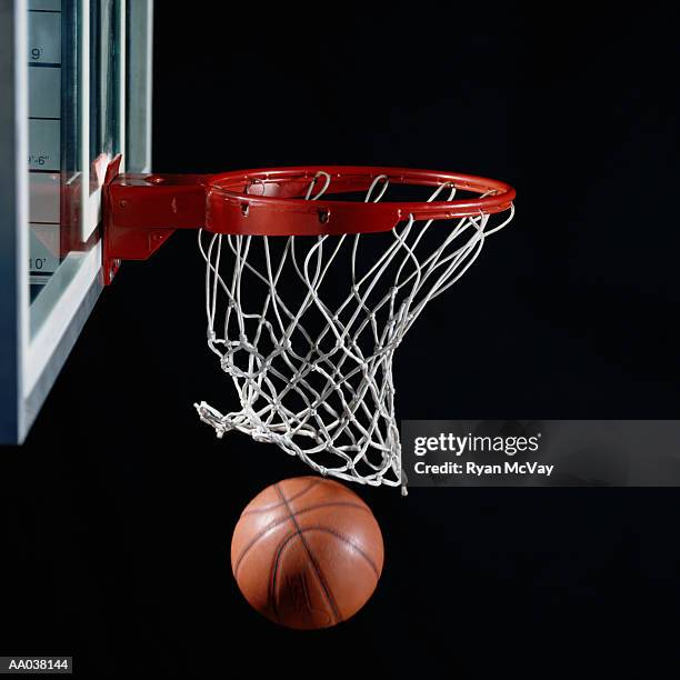 basketball in hoop - basket stock-fotos und bilder