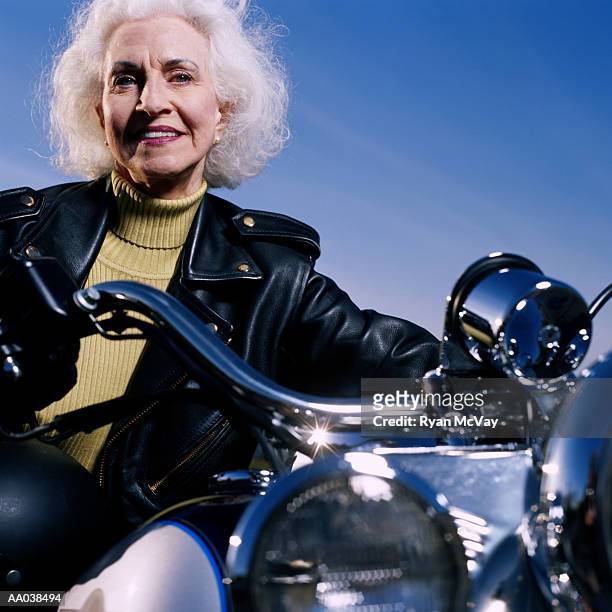 senior woman on motorcycle - motorcycle jacket stock pictures, royalty-free photos & images