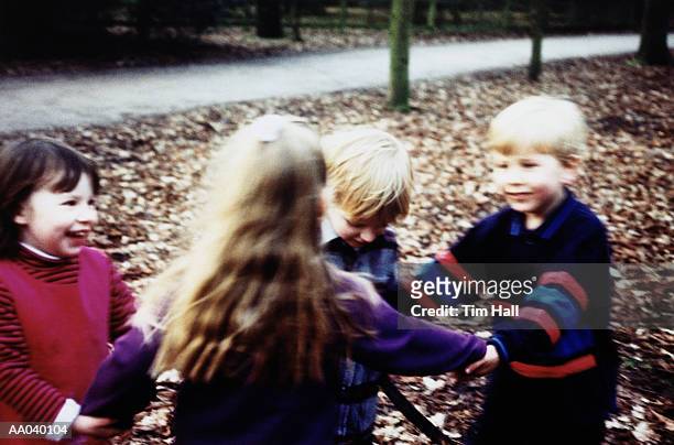 children playing ring-around-the-rosy - ring around the rosy stock pictures, royalty-free photos & images