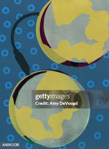 Two globes connected by computer cable Two globes connected by computer cable