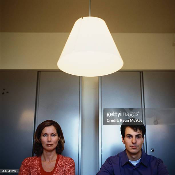 mid adult man and woman - lamp shade imagens e fotografias de stock