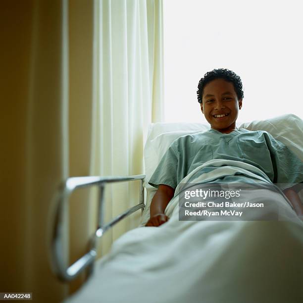 child patient in hospital bed - reed bed stock pictures, royalty-free photos & images