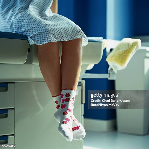 patient waiting on examination table - examination table stock pictures, royalty-free photos & images