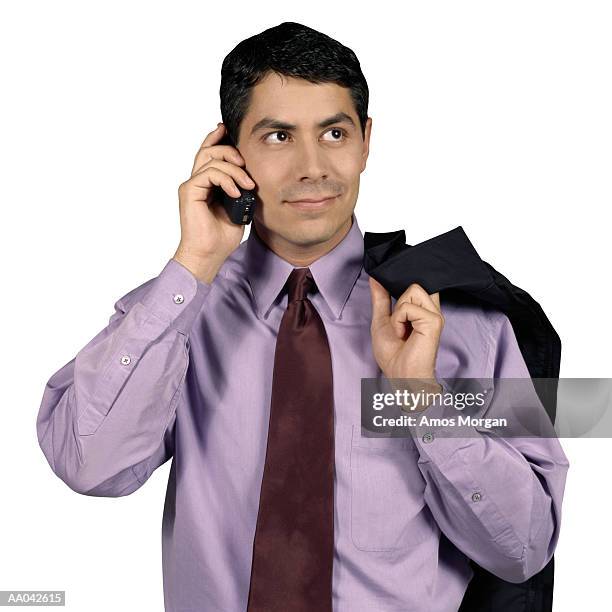 hispanic businessman on mobile phone - buisnessman studio clipping path stock-fotos und bilder