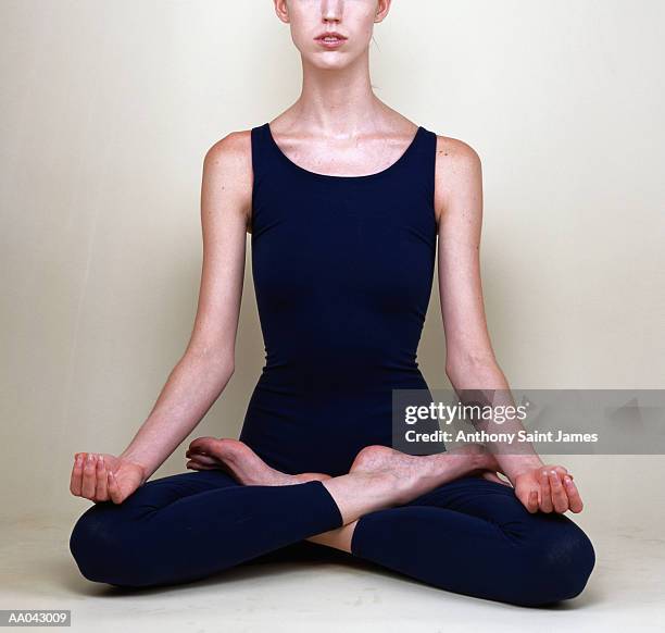 woman in yoga lotus position - james hale stock pictures, royalty-free photos & images