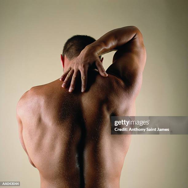 naked man stretching, rear view - james hale stock pictures, royalty-free photos & images