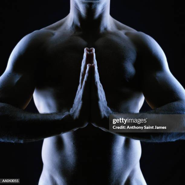 naked man pressing palms together, close-up - james hale stock pictures, royalty-free photos & images