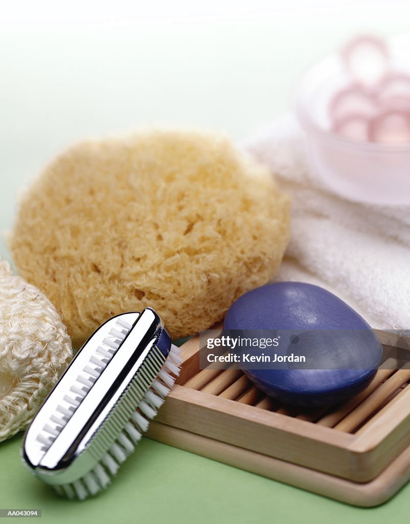 Bath sponge, nail brush and soap, close-up