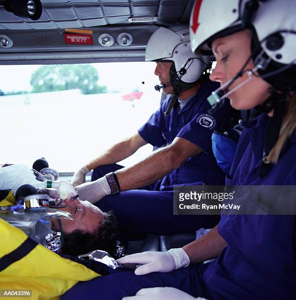 medevac paramedics with patient - medevac stock pictures, royalty-free photos & images