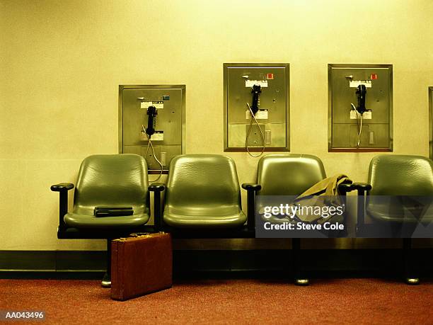 public phone and chairs in room - calm before the storm stock pictures, royalty-free photos & images