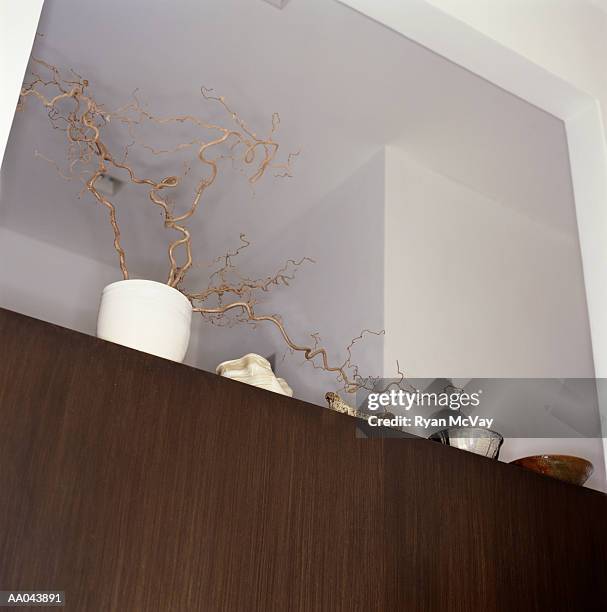 knick knacks on top of cabinet, low angle view - knick stock pictures, royalty-free photos & images