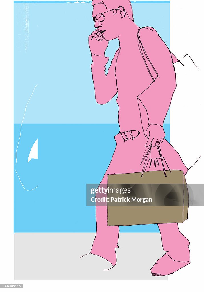 Man with shopping bag on mobile phone