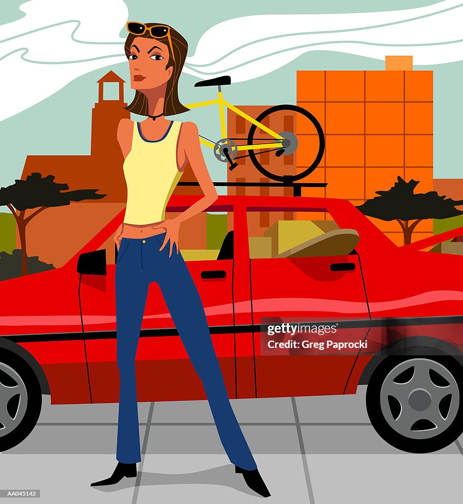 Young woman standing in front of car with bicycle on roof rack