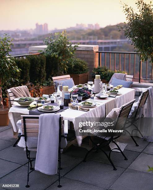 table setting on terrace, dusk - dinner on the deck stock pictures, royalty-free photos & images