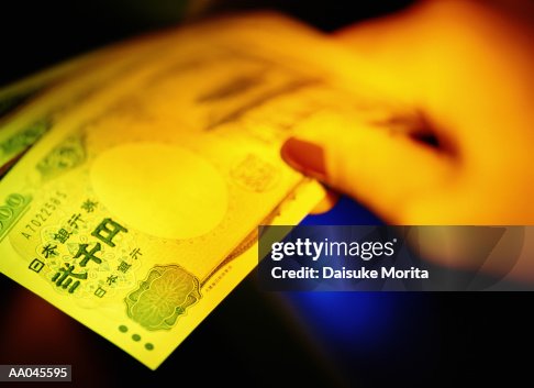 Hand holding 2000 Japanese Yen Hand holding 2000 Japanese Yen