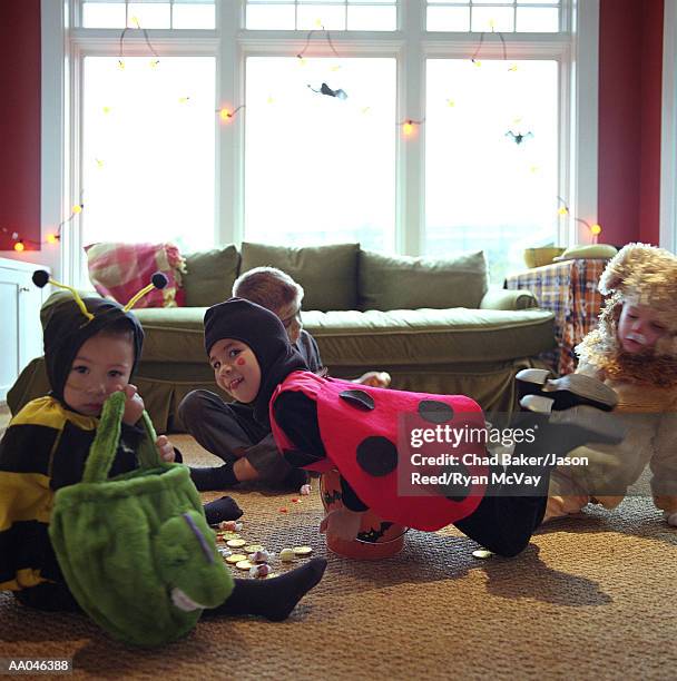 children playing in halloween costumes - bear suit stock-fotos und bilder