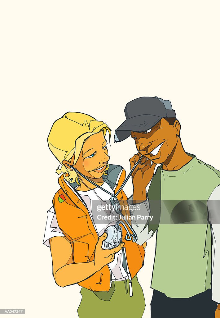 Young couple sharing headphones