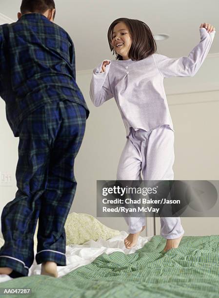 kids jumping on bed - reed bed stock pictures, royalty-free photos & images