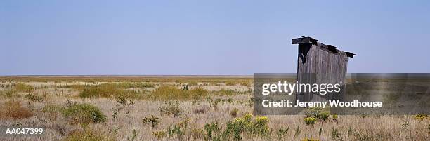 abandoned outhouse - amarillo color stock-fotos und bilder