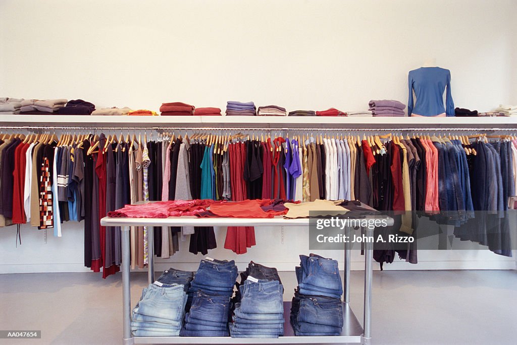 Clothes on rack and table in store