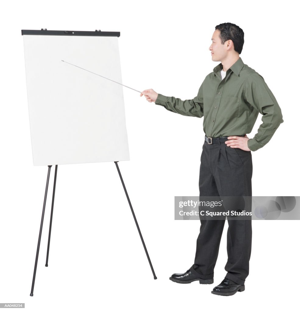 Man pointing at illustration board, side view