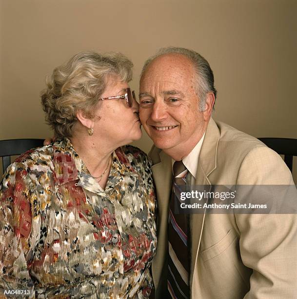 mature woman kissing  man - anthony peck stock pictures, royalty-free photos & images