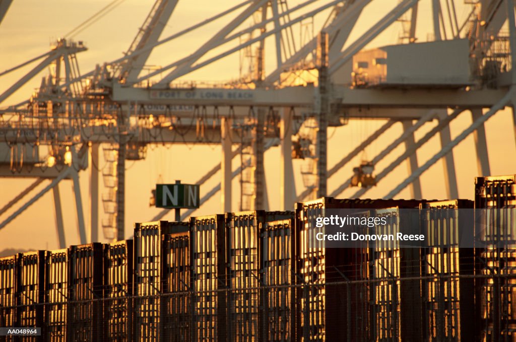 Shipping containers at harbor, sunset