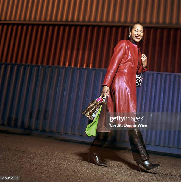 woman with shopping bags, cargo containers in background, portrait - frock coat 個照片及圖片檔