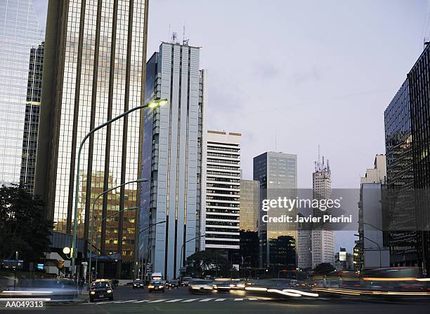 argentina, buenos aires, office buildings, at sunset blurred motion - buenos aires province stock pictures, royalty-free photos & images