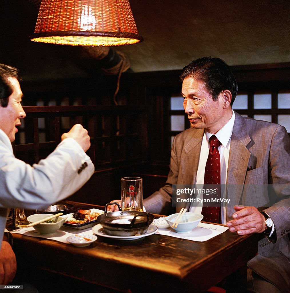 Mature businessmen meeting in restaurant