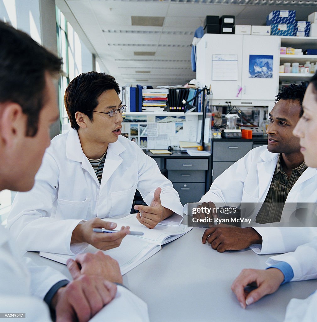 Group of research scientists meeting in research lab