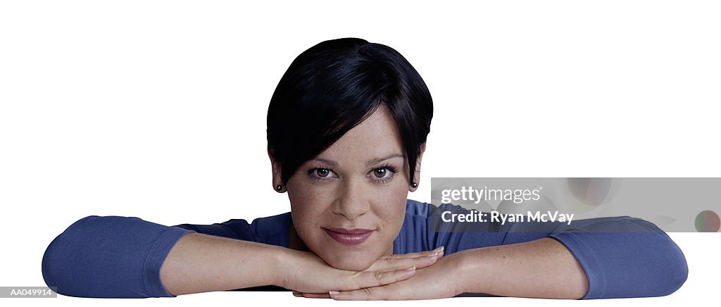 Young Woman Resting Chin on Hands