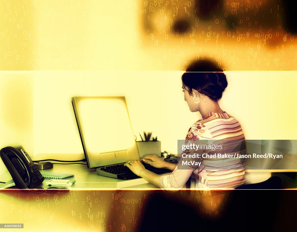 Young woman using computer rear view, digital composite