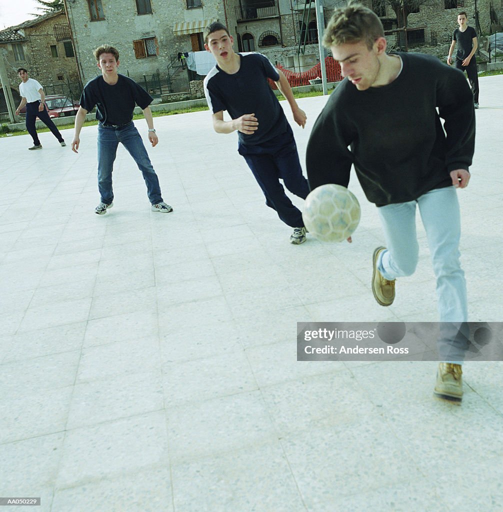 Teenage boys (14-18) playing soccer