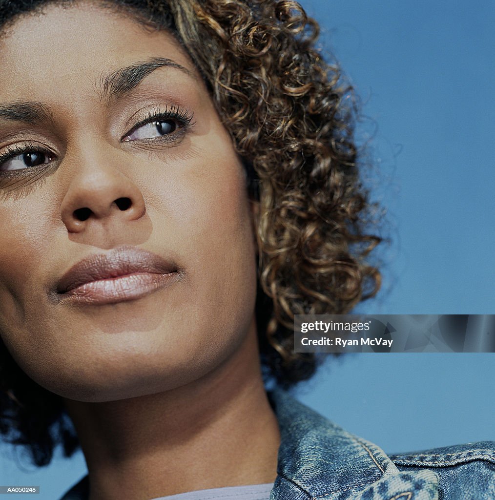 Woman with curly hair, close-up, portrait