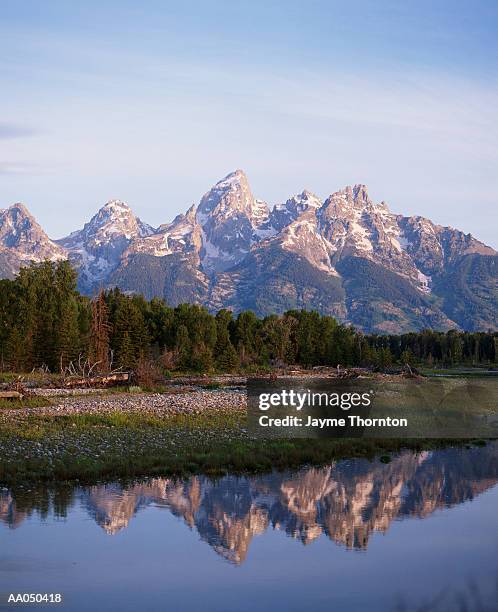 usa, wyoming, peaks of grand tetons reflected in  snake river - supreme fiction stock pictures, royalty-free photos & images