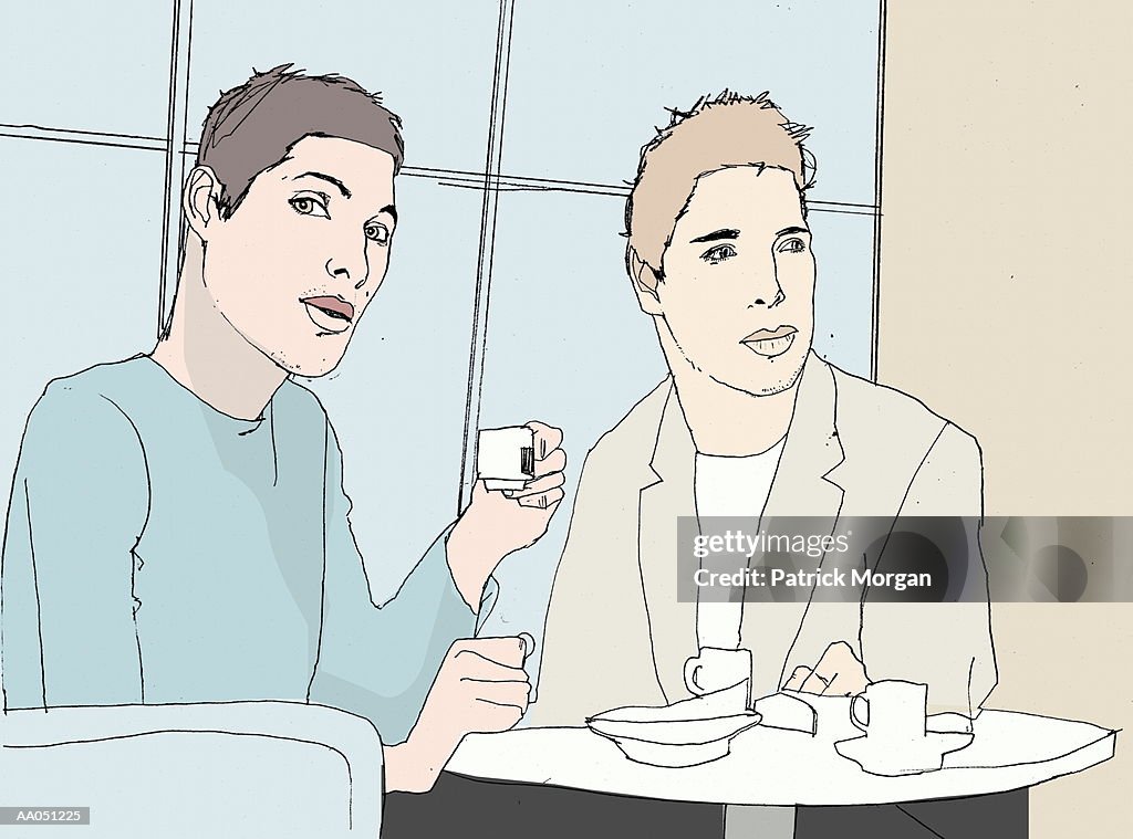 Two young men at table drinking espresso, portrait