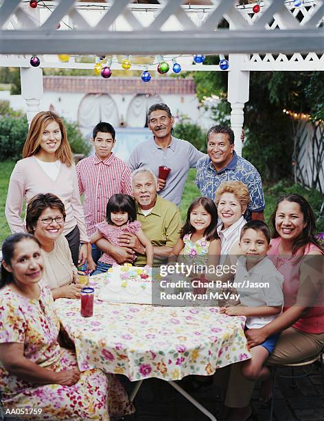 multi-generation family celebrating at party, portrait - great grandfather stock pictures, royalty-free photos & images