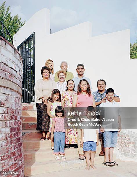 multi-generation family standing on stairway, portrait - great granddaughter stock pictures, royalty-free photos & images
