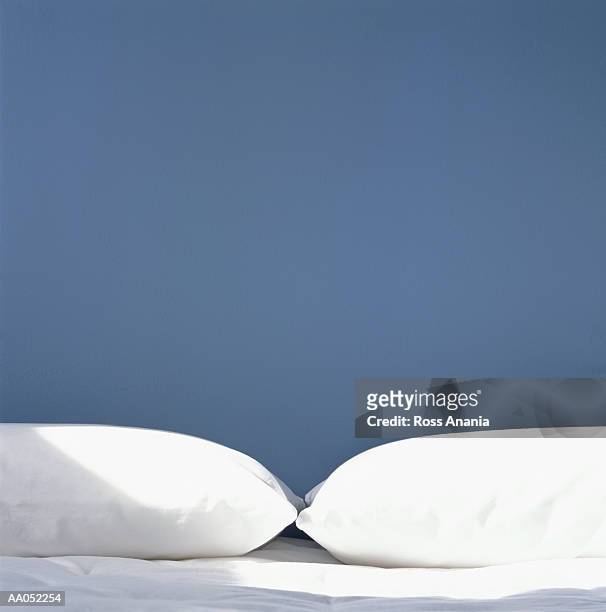 two white pillows side by side on bed - voor hem en haar stockfoto's en -beelden
