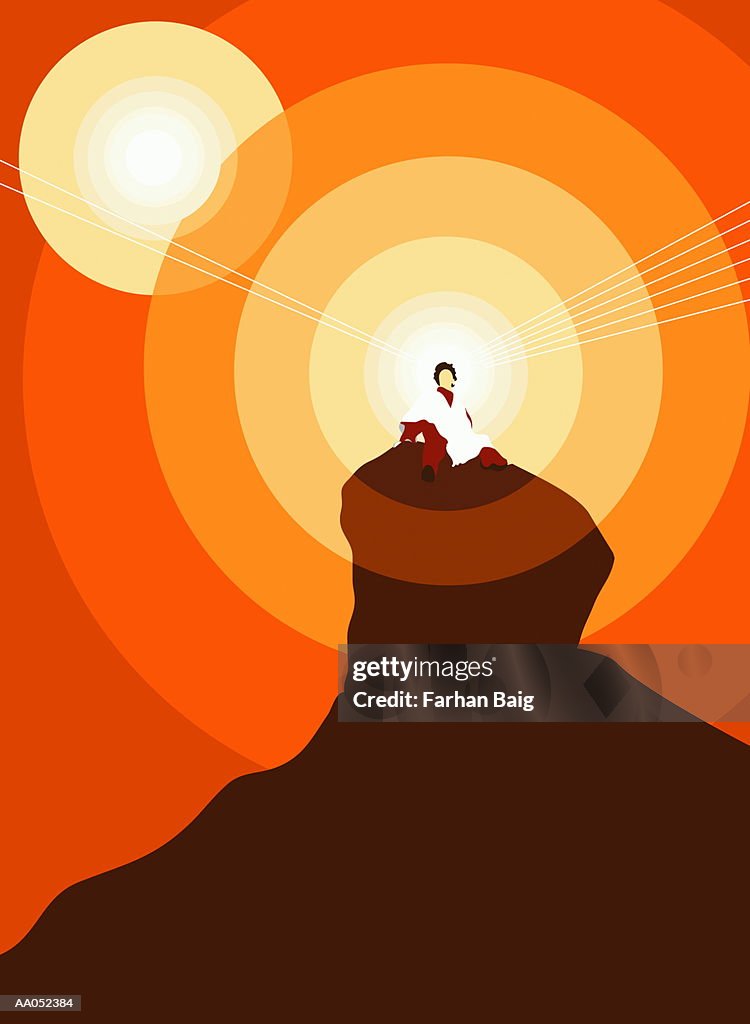 Person sitting on rock, sun in background