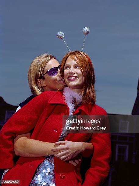 man hugging woman in costume from behind, low angle view - frock coat 個照片及圖片檔